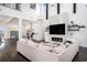 Open-concept living room with fireplace, tall ceilings, modern finishes, and abundant natural light at 1279 Fiddlehead Way, Myrtle Beach, SC 29579