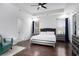Spacious main bedroom with hardwood floors, natural light, and elegant furnishings at 1279 Fiddlehead Way, Myrtle Beach, SC 29579