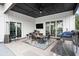 Covered outdoor patio with tile flooring, a ceiling fan, and views of backyard and outdoor kitchen at 1279 Fiddlehead Way, Myrtle Beach, SC 29579