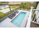 An aerial view showcases a private pool surrounded by lounge chairs, landscaping, and backyard amenities at 1279 Fiddlehead Way, Myrtle Beach, SC 29579