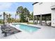 Private backyard oasis featuring a swimming pool, lounge chairs, and covered outdoor living area at 1279 Fiddlehead Way, Myrtle Beach, SC 29579