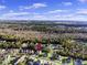 Enjoy stunning aerial views of the neighborhood with tree-lined streets, picturesque lakes, and scenic surroundings at 1303 Bermuda Grass Dr., Myrtle Beach, SC 29579