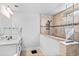 Bathroom featuring tan and beige tile, a glass shower, and a white vanity at 1303 Bermuda Grass Dr., Myrtle Beach, SC 29579