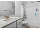 Bathroom featuring white cabinets, a toilet, and a tub and shower combination at 1303 Bermuda Grass Dr., Myrtle Beach, SC 29579