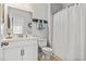 Well-lit bathroom with a white vanity, nautical decor, and a shower-tub combination at 1303 Bermuda Grass Dr., Myrtle Beach, SC 29579