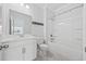 Bright bathroom featuring a shower-tub combo and a vanity with a light countertop and cabinet at 1303 Bermuda Grass Dr., Myrtle Beach, SC 29579