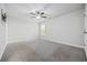 Bedroom with carpet, neutral paint, ceiling fan, and a large window, offering a serene space at 1303 Bermuda Grass Dr., Myrtle Beach, SC 29579