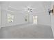Spacious main bedroom featuring carpet floors, natural light, and an en-suite bathroom at 1303 Bermuda Grass Dr., Myrtle Beach, SC 29579
