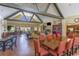 Bright and spacious clubhouse featuring a soaring ceiling, expansive seating, a fireplace, and a well-equipped kitchen at 1303 Bermuda Grass Dr., Myrtle Beach, SC 29579