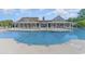 A large, inviting community pool is surrounded by ample seating, offering residents a refreshing and relaxing space at 1303 Bermuda Grass Dr., Myrtle Beach, SC 29579