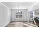 Bright and airy dining room featuring wood flooring and a modern chandelier at 1303 Bermuda Grass Dr., Myrtle Beach, SC 29579