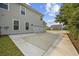 Side view of a home with a spacious driveway leading to an attached garage, set in a residential neighborhood at 1303 Bermuda Grass Dr., Myrtle Beach, SC 29579