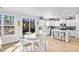 Bright kitchen with white cabinetry, stainless steel appliances, and sliding glass doors to outdoors at 1303 Bermuda Grass Dr., Myrtle Beach, SC 29579