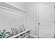 Cozy mudroom with a built-in bench, storage cubbies, and decorative beach-themed pillows at 1303 Bermuda Grass Dr., Myrtle Beach, SC 29579