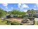 Charming fenced playground area with modern equipment and mature trees, great for Gathering fun at 1303 Bermuda Grass Dr., Myrtle Beach, SC 29579