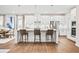 Bright, spacious kitchen featuring modern appliances, a center island with seating, and elegant white cabinetry at 1312 Piper Glen Dr, Sunset Beach, NC 28468