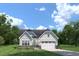 Charming single-story home with a combination of siding and stone, a two-car garage, and a well-manicured lawn at 1324 Piper Glen Dr, Sunset Beach, NC 28468