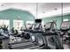 Well-equipped fitness center featuring rows of treadmills, elliptical machines, and weight training equipment at 1324 Piper Glen Dr, Sunset Beach, NC 28468