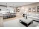 Stylish living room open to the kitchen, with an island, plush seating, and neutral decor at 1324 Piper Glen Dr, Sunset Beach, NC 28468