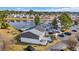 Aerial view of the property overlooking a peaceful lake with lush landscaping at 1360 Turkey Ridge Rd. # A, Surfside Beach, SC 29575