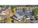 Aerial view showcasing lakefront townhomes with well-manicured lawns and parking at 1360 Turkey Ridge Rd. # A, Surfside Beach, SC 29575