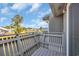 Balcony featuring a wooden railing and community pond views with neighborhood beyond at 1360 Turkey Ridge Rd. # A, Surfside Beach, SC 29575