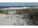 Sandy path leading to a beautiful beach, framed by dunes and vegetation at 1360 Turkey Ridge Rd. # A, Surfside Beach, SC 29575