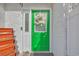 Inviting front door with bright green paint, beautiful wreath, and white trim at 1360 Turkey Ridge Rd. # A, Surfside Beach, SC 29575