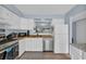 Well-equipped kitchen with white cabinets, stainless steel appliances and modern countertops at 1360 Turkey Ridge Rd. # A, Surfside Beach, SC 29575