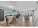 Spacious open-concept living room with ample seating and natural light, adjacent to dining area at 1360 Turkey Ridge Rd. # A, Surfside Beach, SC 29575