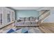 Cozy living room featuring a comfortable sofa and view of the staircase at 1360 Turkey Ridge Rd. # A, Surfside Beach, SC 29575