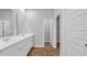 Bathroom with double vanity and an open doorway to a storage or closet space at 1372 Palm Springs Paloma Dr, Longs, SC 29568