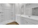 Bathroom featuring a shower and a double vanity with modern white cabinetry at 1372 Palm Springs Paloma Dr, Longs, SC 29568