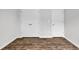 Bedroom with closet space and hardwood floors, providing ample storage and style at 1372 Palm Springs Paloma Dr, Longs, SC 29568