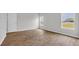 Bright, sunny bedroom with durable floors, neutral walls, and window with neighborhood view at 1372 Palm Springs Paloma Dr, Longs, SC 29568