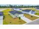 A new construction home with an attached garage and a well-manicured lawn in a suburban neighborhood at 1372 Palm Springs Paloma Dr, Longs, SC 29568
