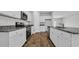 Well-designed kitchen featuring granite countertops, stainless steel appliances, and white cabinets at 1372 Palm Springs Paloma Dr, Longs, SC 29568