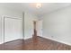 Spacious bedroom features hardwood floors, closet and entrance to hallway at 1435 Saint Thomas Circle # E-1, Myrtle Beach, SC 29577