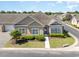 Beautifully landscaped front yard of a cozy home with manicured bushes and lawn at 1435 Saint Thomas Circle # E-1, Myrtle Beach, SC 29577