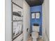 Cozy bathroom with beach themed decorations, a tiled ceiling, and brightly painted accent wall at 1501 S Ocean Blvd. # 1250, Myrtle Beach, SC 29577