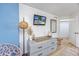 Bright bedroom featuring a flatscreen TV, stylish decor, and a modern dresser at 1501 S Ocean Blvd. # 1250, Myrtle Beach, SC 29577