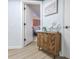 Inviting hallway with a wood cabinet, coastal decor, and a view into the bedroom at 1501 S Ocean Blvd. # 1250, Myrtle Beach, SC 29577