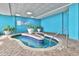 Indoor hot tub with steps and decorative plants at 1501 S Ocean Blvd. # 1250, Myrtle Beach, SC 29577