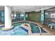 Indoor hot tub area with blue tile and tropical decor at 1501 S Ocean Blvd. # 1250, Myrtle Beach, SC 29577