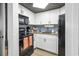Well-equipped kitchen featuring modern appliances, white cabinets, and ample counter space at 1501 S Ocean Blvd. # 1250, Myrtle Beach, SC 29577