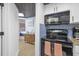 Efficient kitchen offers black appliances and easy access to the bedroom at 1501 S Ocean Blvd. # 1250, Myrtle Beach, SC 29577