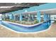 Indoor lazy river with shallow water and decorative plants at 1501 S Ocean Blvd. # 1250, Myrtle Beach, SC 29577