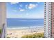 Breathtaking ocean view from the balcony, showcasing the beach and the building's exterior at 1501 S Ocean Blvd. # 1250, Myrtle Beach, SC 29577