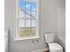Bathroom features a toilet and bright window for natural light at 154 Six Mile Creek Dr., Georgetown, SC 29440