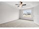 Bedroom with a large window offering views of the backyard with a lake at 154 Six Mile Creek Dr., Georgetown, SC 29440